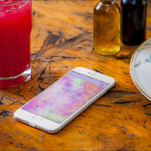 Chromecast app shown running on iPhone on a table