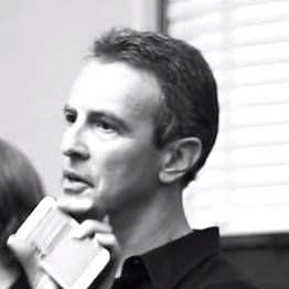 A photo of Chris in a chair being interviewed for CreateAthon